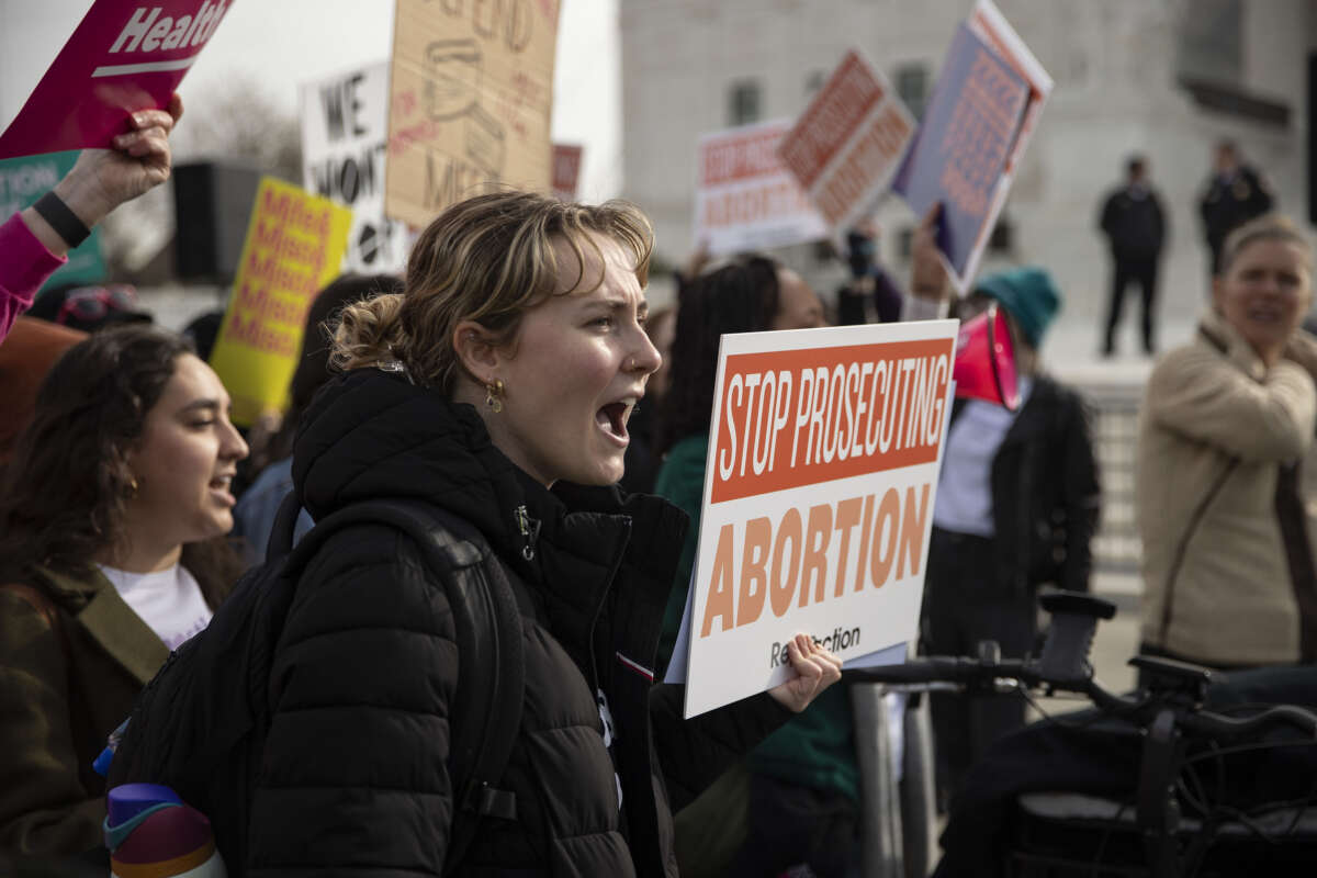 People gather to rally on broad access to the abortion pill outside the U.S. Supreme Court as justices hear oral arguments in a bid by President Joe Biden's administration to preserve broad access to abortion pill in Washington D.C., on March 26, 2024.