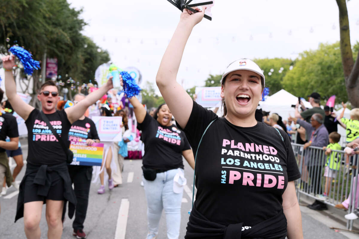 A marcher wears a shirt reading "PLANNED PARENTHOOD LOS ANGELES HAS PRIDE" during a pride parade