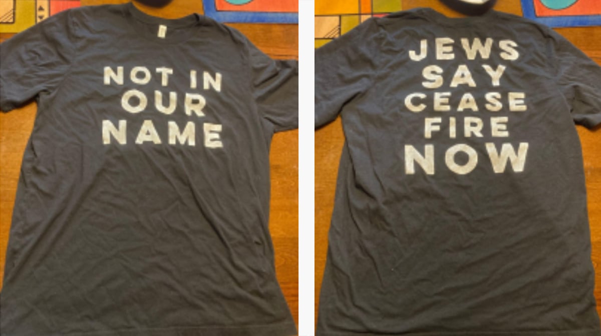 On the left, the front of the shirt, reading “NOT IN OUR NAME” in white text on black fabric; on the right, the back of the shirt, reading "JEWS SAY CEASEFIRE NOW."