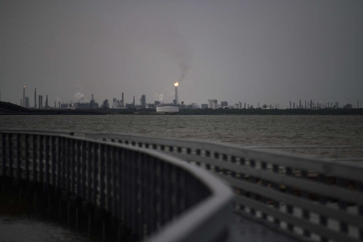 A flaring stack in Port Comfort can be seen from a nature boardwalk in Port Lavaca, Texas, on July 7, 2024.