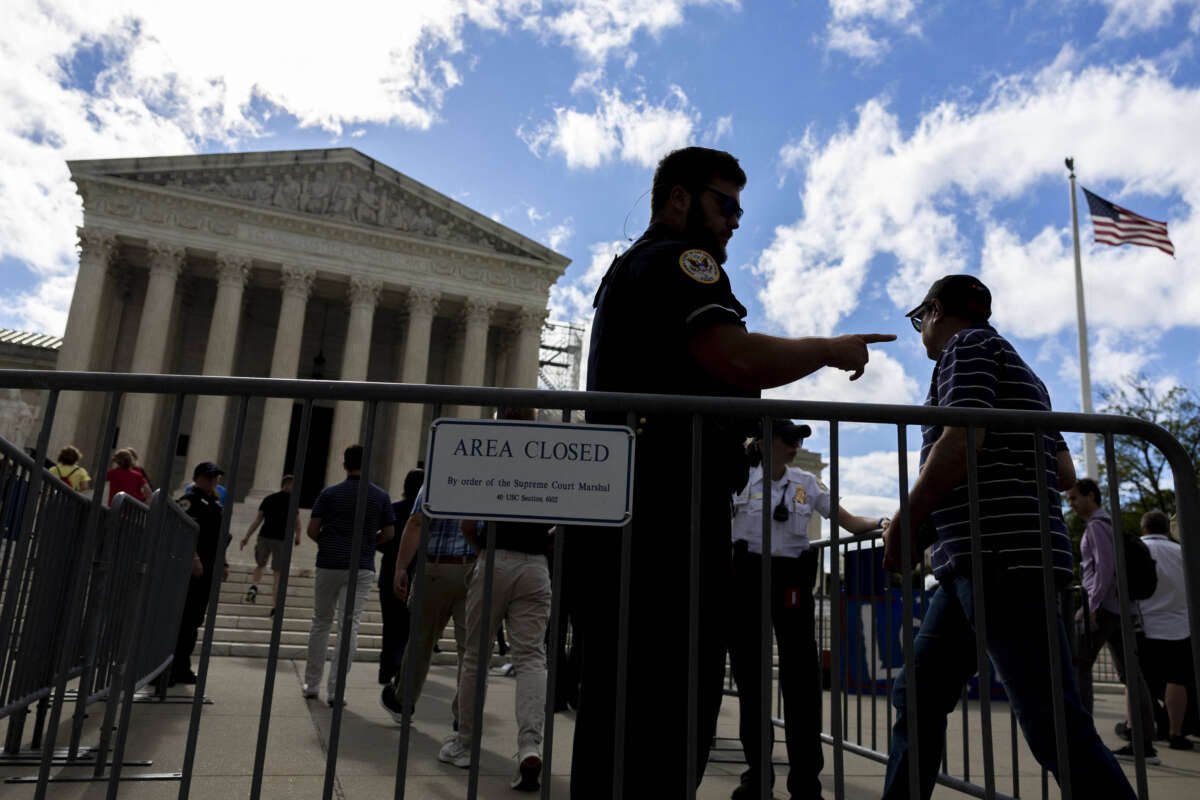 People who are watching the proceedings are escorted past a security gate at the Supreme Court of the United States in Washington, D.C., on July 1, 2024.
