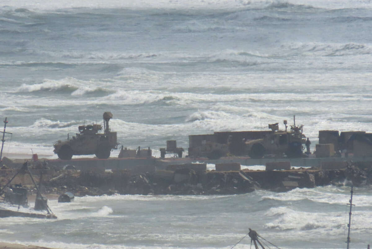A view of a damaged floating pier, set up by the U.S. to facilitate quicker delivery of humanitarian aid to Palestinians, after it has been suspended due to adverse weather conditions and rising sea levels in Gaza City, Gaza on May 27, 2024.