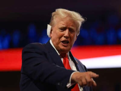 Former President Donald Trump attends the first day of the Republican National Convention at the Fiserv Forum on July 15, 2024, in Milwaukee, Wisconsin.