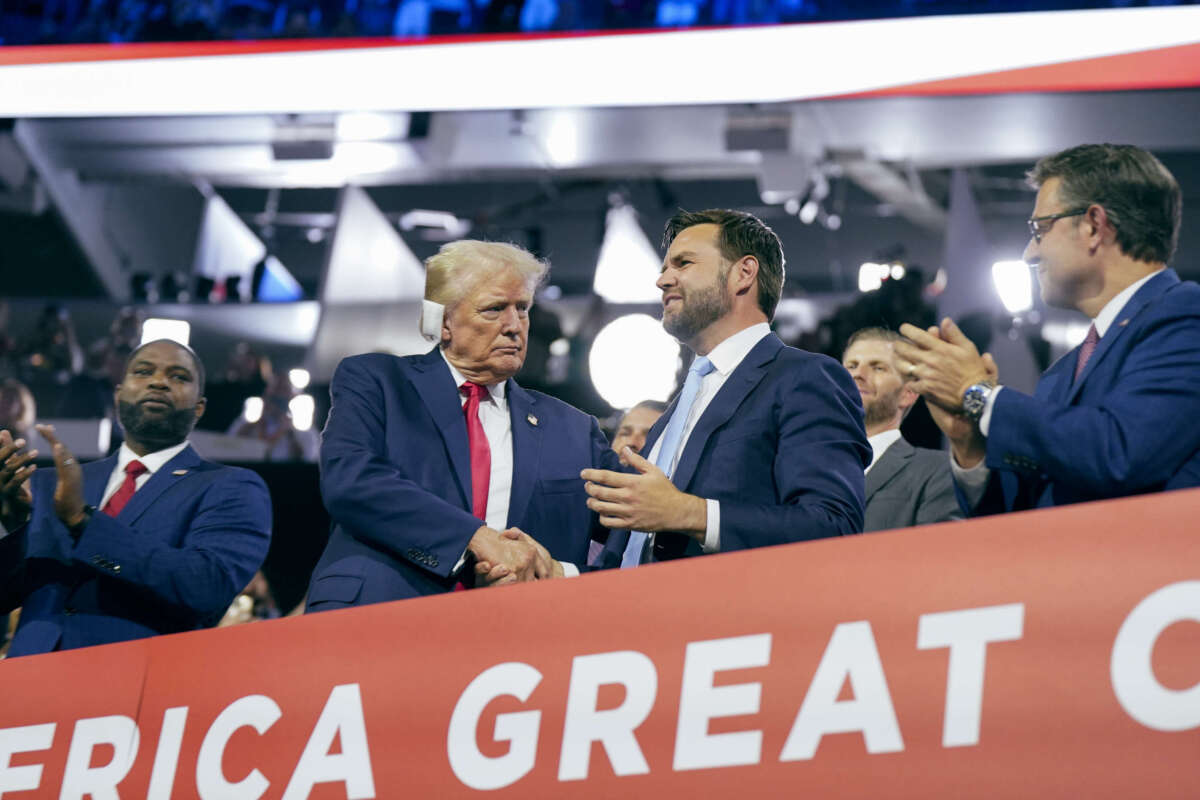Former President Donald Trump makes an appearance next to Sen. J.D. Vance at Fiserv Forum on July 15, 2024, on the first day of the Republican National Convention in downtown Milwaukee, Wisconsin.