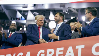 Former President Donald Trump makes an appearance next to Sen. J.D. Vance at Fiserv Forum on July 15, 2024, on the first day of the Republican National Convention in downtown Milwaukee, Wisconsin.