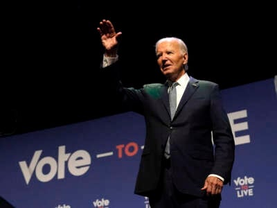 President Joe Biden waves on stage during the Vote To Live Properity Summit at the College of Southern Nevada in Las Vegas, Nevada, on July 16, 2024.