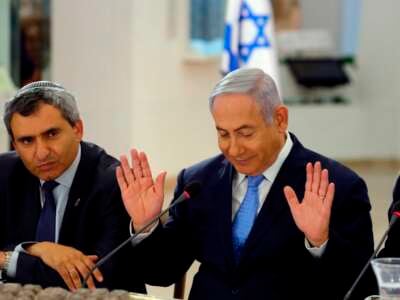 Israeli Prime Minister Benjamin Netanyahu (right) and then-Minister of Jerusalem and Environmental Protection Zeev Elkin attend a special cabinet meeting marking Jerusalem Day, at the Bible Lands Museum in Jerusalem, on May 13, 2018.