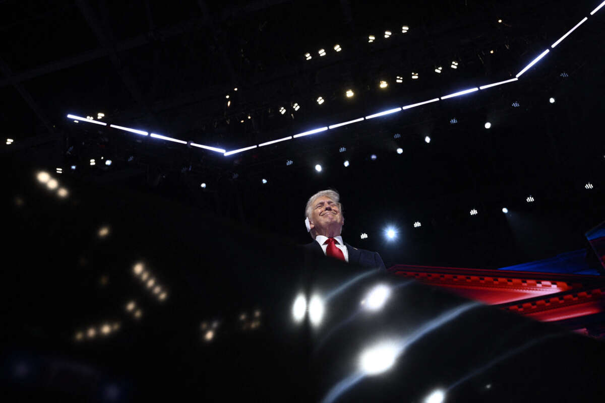 Former President Donald Trump stands onstage during the last day of the 2024 Republican National Convention at the Fiserv Forum in Milwaukee, Wisconsin, on July 18, 2024.