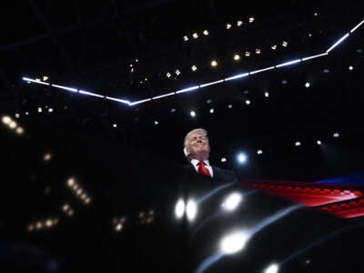 Former President Donald Trump stands onstage during the last day of the 2024 Republican National Convention at the Fiserv Forum in Milwaukee, Wisconsin, on July 18, 2024.