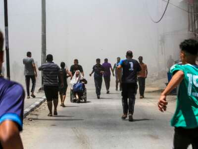 People flee al-Bureij refugee camp in the central Gaza Strip following Israeli bombardment on July 23, 2024.