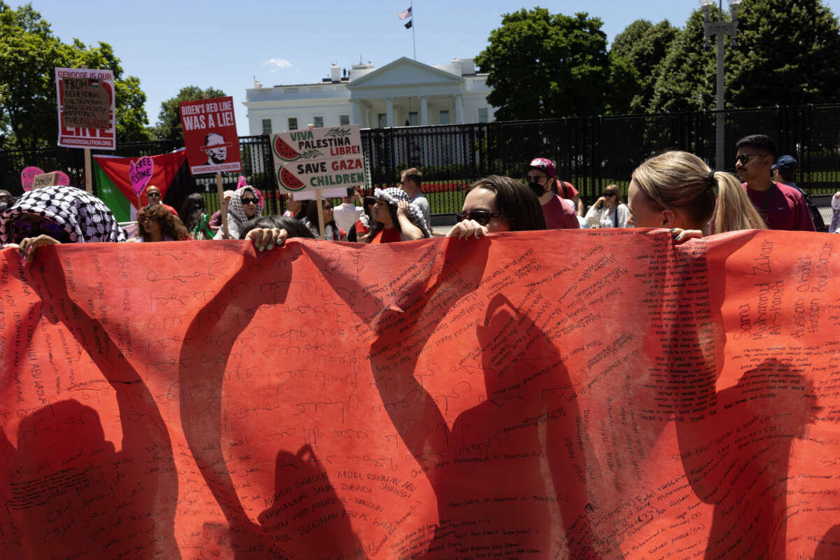 Pro-Palestine demonstrators surround the White House to protest the Biden administration's continued support of Israel, on June 8, 2024, in Washington, D.C.