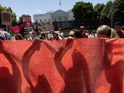 Pro-Palestine demonstrators surround the White House to protest the Biden administration's continued support of Israel, on June 8, 2024, in Washington, D.C.