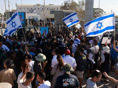 Right-wing Israelis demonstrate next to the Sde Teman military base near Beersheba, against the detention for questioning of military reservists who were suspected of abuse of a detainee following the October 7 attack in Israel, on July 29, 2024.