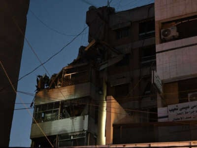 A view of a destroyed building as security forces and health care crew arrive on site following an Israeli military strike on Beirut's southern suburbs on July 30, 2024, in Lebanon.