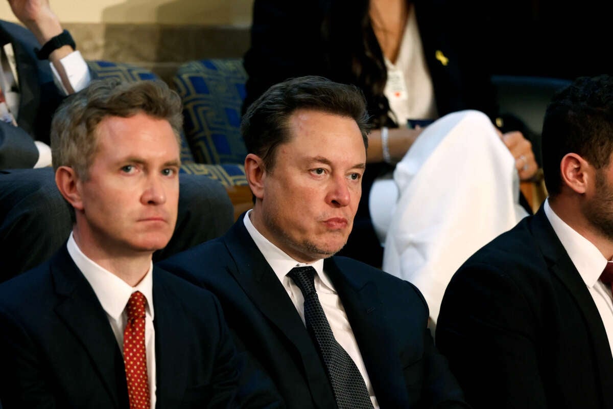 Tesla CEO Elon Musk (center) listens as Israeli Prime Minister Benjamin Netanyahu addresses a joint meeting of Congress in the chamber of the House of Representatives at the U.S. Capitol on July 24, 2024, in Washington, D.C.