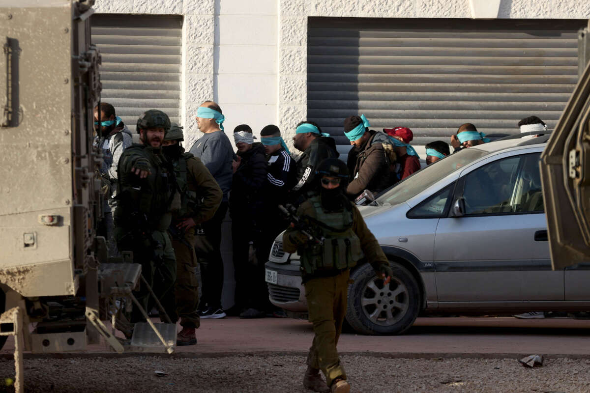 Israeli forces detain a number of Palestinians as they raid Tulkarm refugee camp in Tulkarm, West Bank, on January 18, 2024.