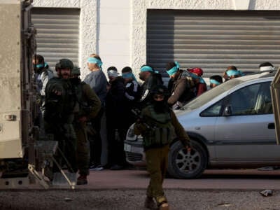 Israeli forces detain a number of Palestinians as they raid Tulkarm refugee camp in Tulkarm, West Bank, on January 18, 2024.