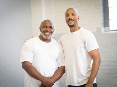 Michael Broadway, who died on June 19 at Stateville Correctional Center, excelled at educating himself in prison, graduating with a degree from Northwestern University. In this photo, taken at Stateville’s study hall in summer 2022, Broadway (left) stands with fellow student Michael Simmons.