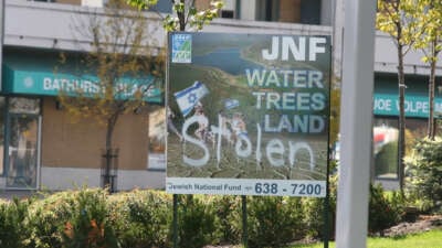 Sign for the Jewish National Fund defaced to protest the Israeli occupation of Palestine, in Toronto, Ontario, Canada, on October 9, 2008.