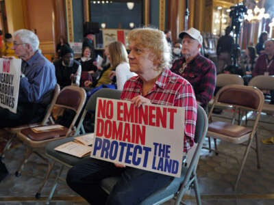 Guests attend a rally hosted by Free Soil at the Iowa State Capitol building to oppose building a CO2 pipeline, on January 10, 2024, in Des Moines, Iowa.