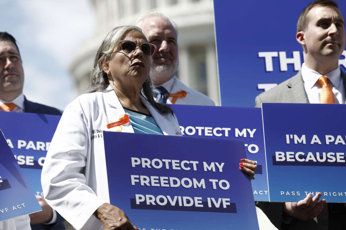 Medical workers and IVF patients listen during a news conference on access to in vitro fertilization (IVF) treatments outside of the U.S. Capitol Building on June 12, 2024, in Washington, D.C.