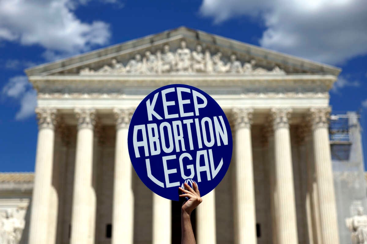 An abortion rights advocate participates in a protest outside of the U.S. Supreme Court Building on June 24, 2024, in Washington, D.C.