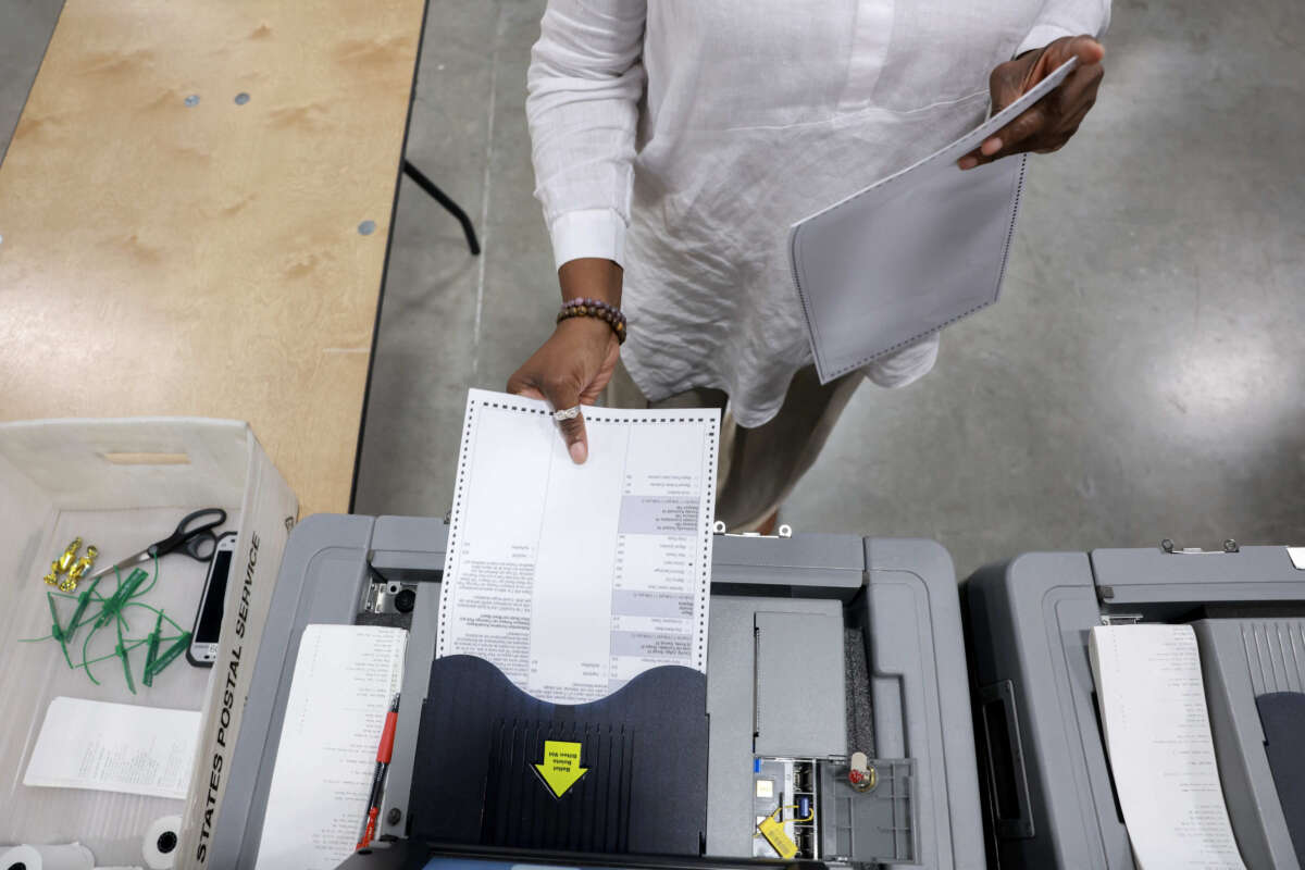 A Miami-Dade election worker checks voting machines for accuracy at the Miami-Dade Election Department headquarters on July 31, 2024, in Doral, Florida.