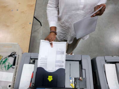 A Miami-Dade election worker checks voting machines for accuracy at the Miami-Dade Election Department headquarters on July 31, 2024, in Doral, Florida.