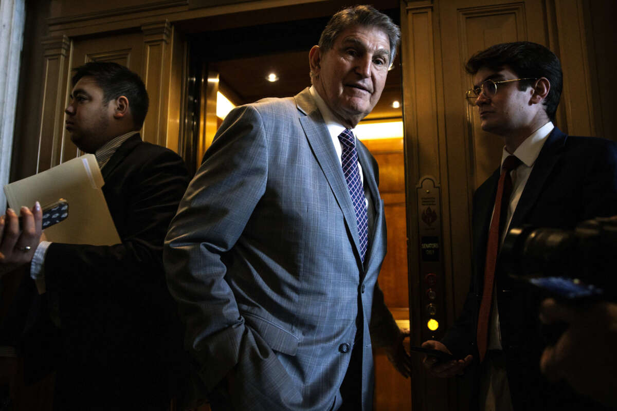 Sen. Joe Manchin talks to reporters as he leaves the Senate floor following a vote on January 23, 2024, in Washington, D.C.