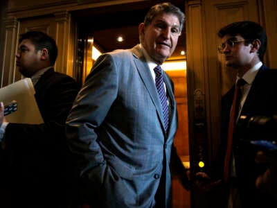 Sen. Joe Manchin talks to reporters as he leaves the Senate floor following a vote on January 23, 2024, in Washington, D.C.