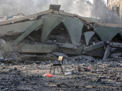 Palestinian living in the area inspect the rubbles of the destroyed school building following an Israeli attack on Haditha School, in Deir al-Balah, Gaza, on July 28, 2024.