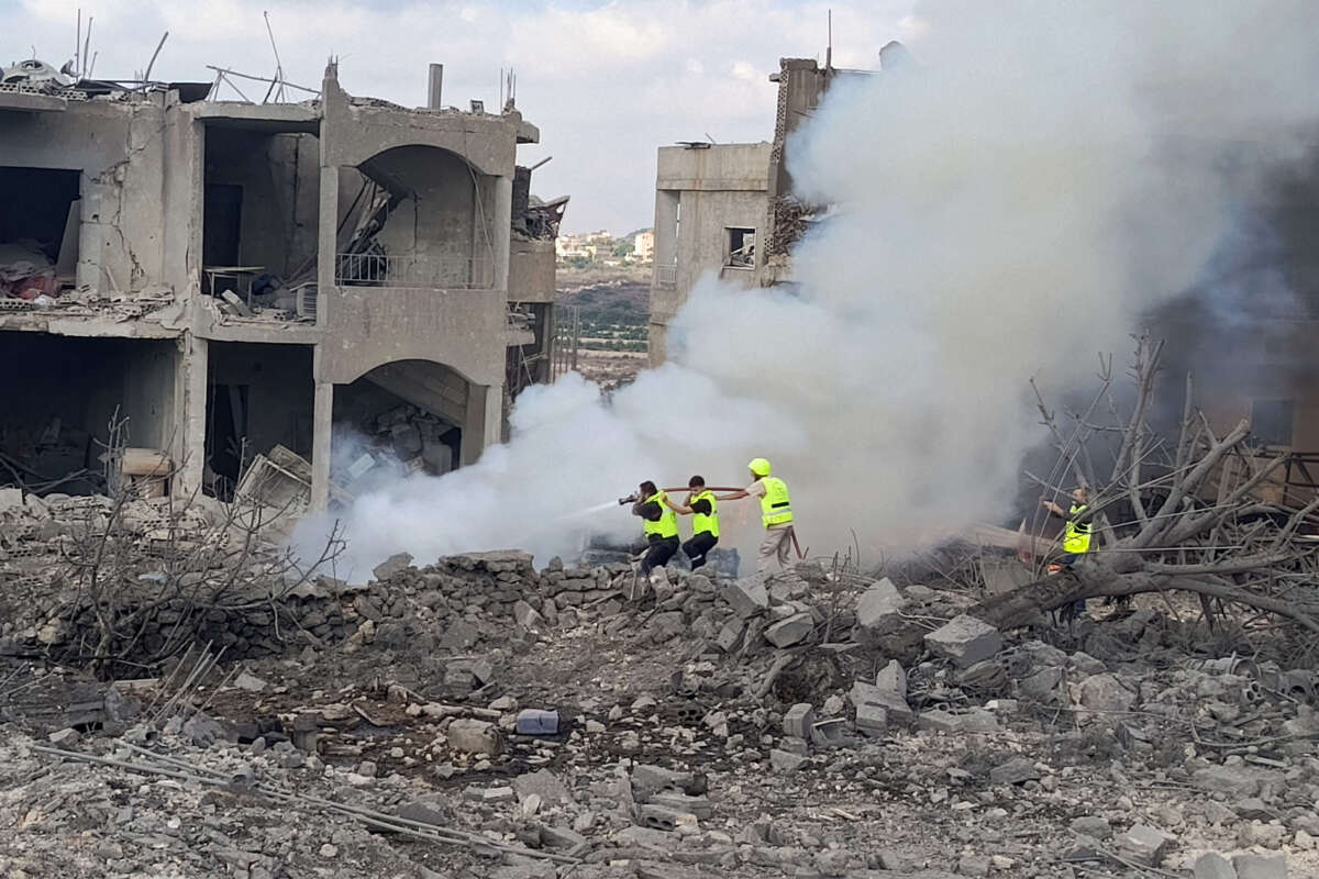 Lebanese civil defence workers extinguish a fire following an Israeli air raid on the town of Shamaa (Chamaa) in southern Lebanon on August 1, 2024, amid ongoing cross-border clashes between Israeli troops and Hezbollah fighters.