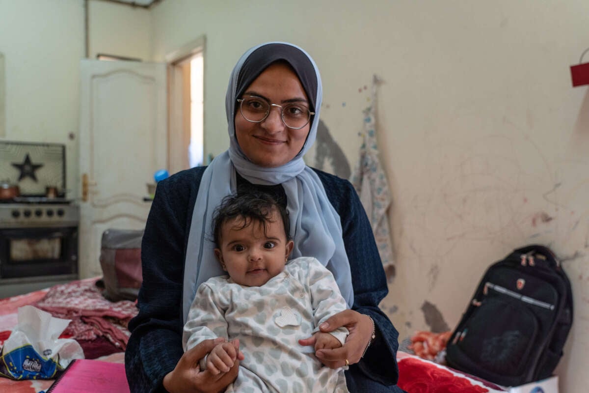 Hashim with her baby Watin, born in Khan Younis during the war.