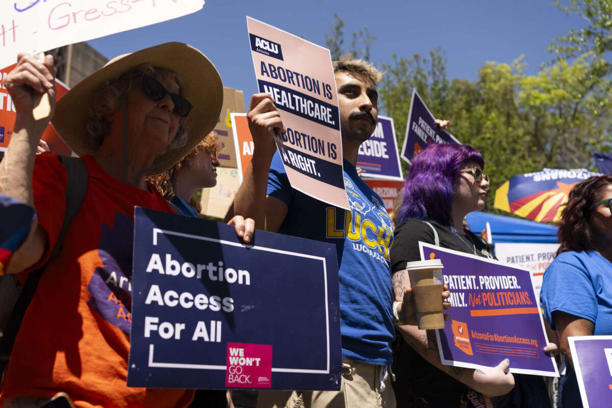 Members of Arizona for Abortion Access, the ballot initiative to enshrine abortion rights in the Arizona State Constitution, hold a press conference and protest at the Arizona House of Representatives on April 17, 2024, in Phoenix, Arizona.