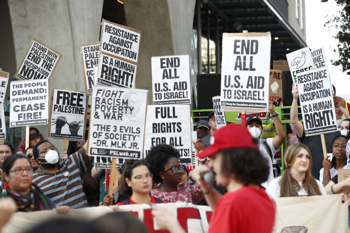 Pro-Palestine supporters protest, demanding a ceasefire between Israel and Gaza, in the downtown area on June 27, 2024, in Atlanta, Georgia.