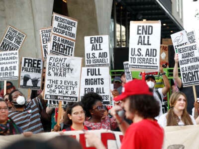 Pro-Palestine supporters protest, demanding a ceasefire between Israel and Gaza, in the downtown area on June 27, 2024, in Atlanta, Georgia.