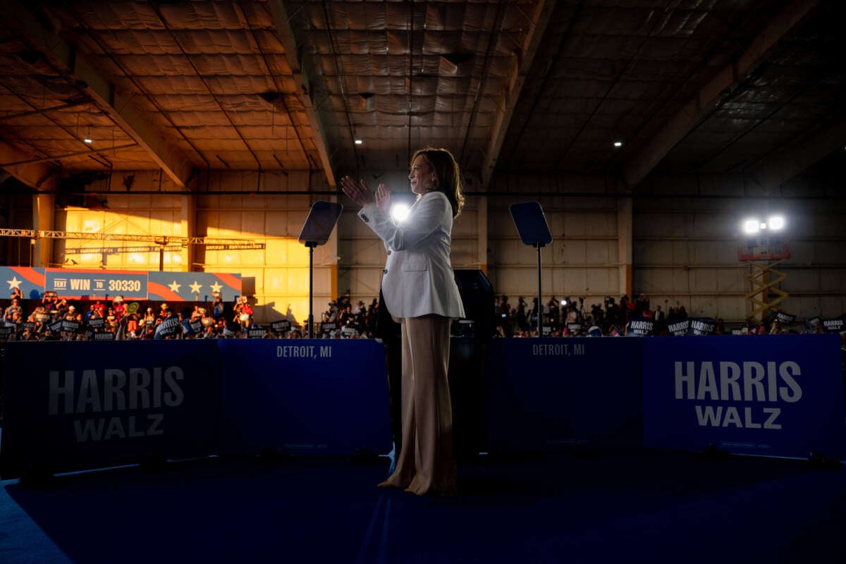 Vice President Kamala Harris stands on stage during a campaign event at Detroit Metropolitan Wayne County Airport on August 7, 2024, in Detroit, Michigan.