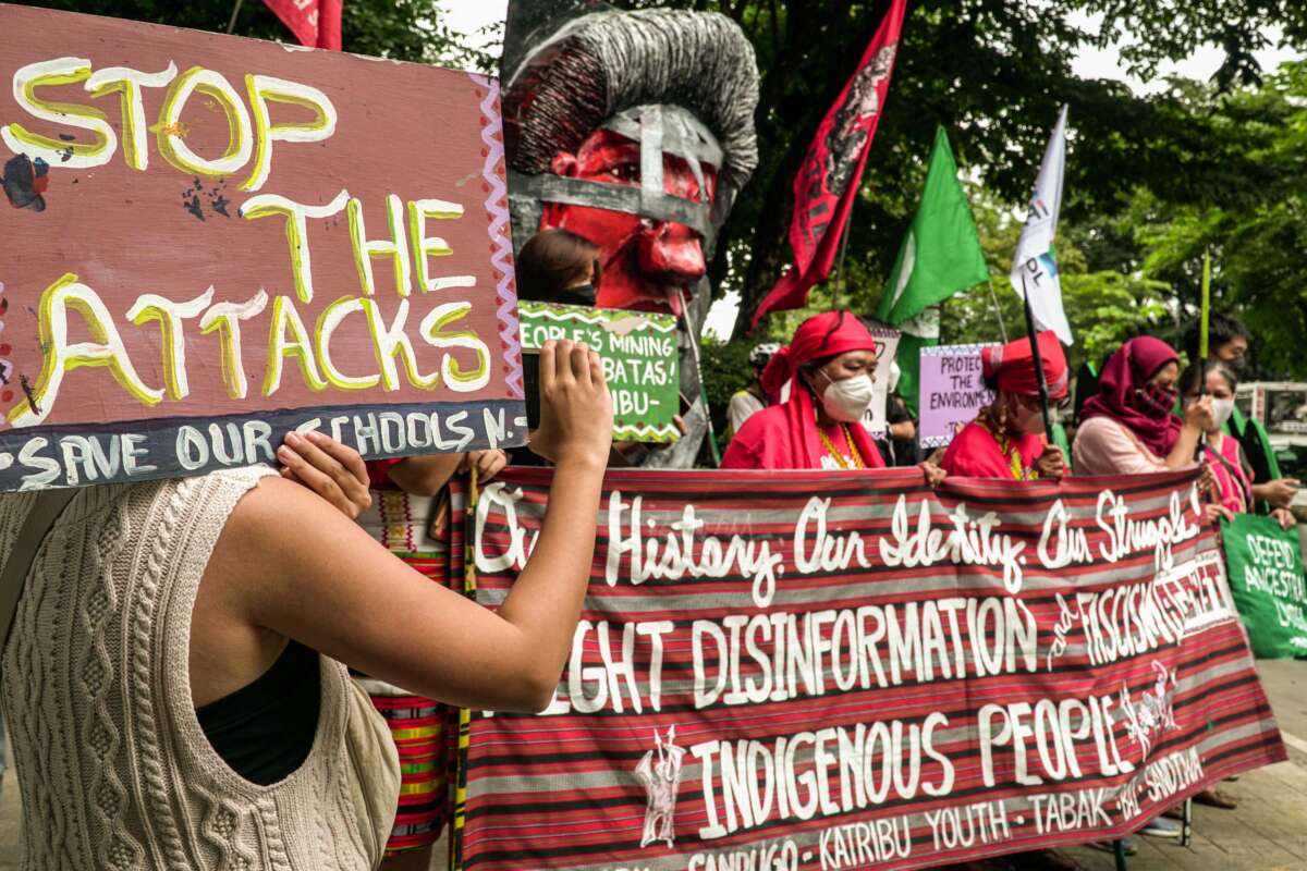 Indigenous people and advocates hold a protest to commemorate the International Day of the World's Indigenous Peoples at the Department of Environment and Natural Resources in Quezon City, Philippines, on August 9, 2022.