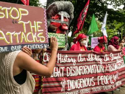 Indigenous people and advocates hold a protest to commemorate the International Day of the World's Indigenous Peoples at the Department of Environment and Natural Resources in Quezon City, Philippines, on August 9, 2022.