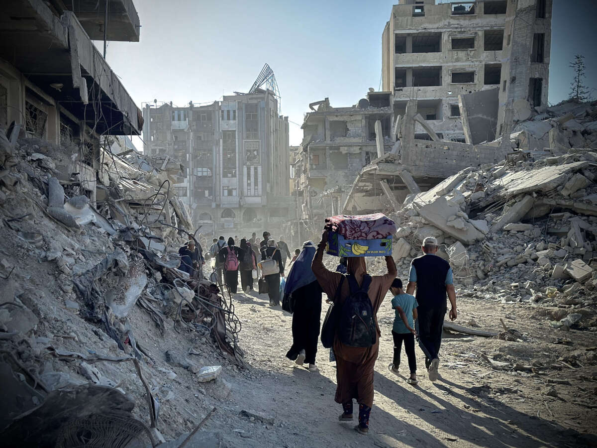 Palestinians leave their homes after Israel issued an evacuation warning as Israel's attacks continue in eastern Khan Yunis, Gaza, on August 8, 2024.