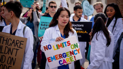 A group of doctors join abortion rights supporters at a rally outside the Supreme Court on April 24, 2024, in Washington, D.C.