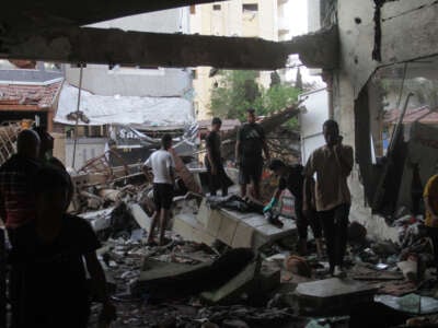 People conduct rescue work in a destroyed building after an Israeli airstrike in Al-Daraj neighborhood in Gaza City, August 10, 2024.