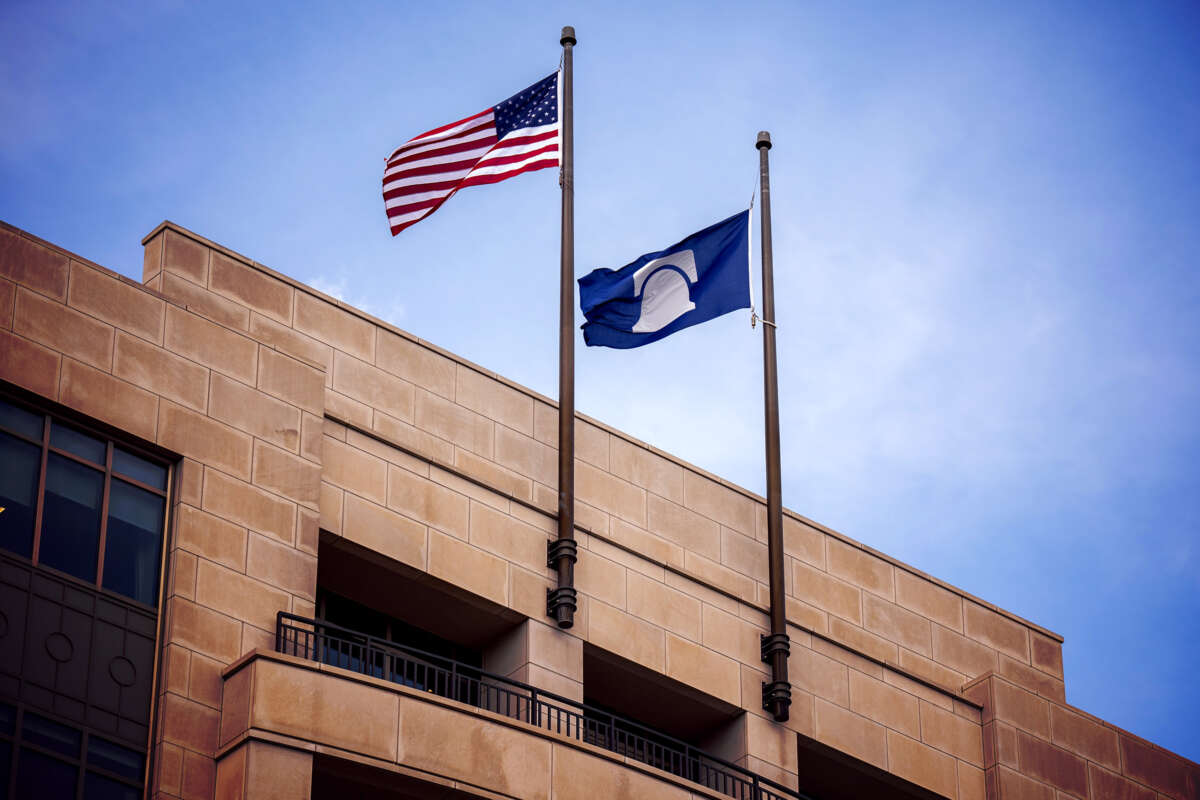 The U.S. and Heritage Foundation flags fly next to oneanother outside of the Heritage Foundation headquarters