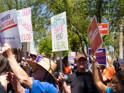 Members of Arizona for Abortion Access, the ballot initiative to enshrine abortion rights in the Arizona State Constitution, hold a press conference at the Arizona House of Representatives on April 17, 2024, in Phoenix, Arizona.