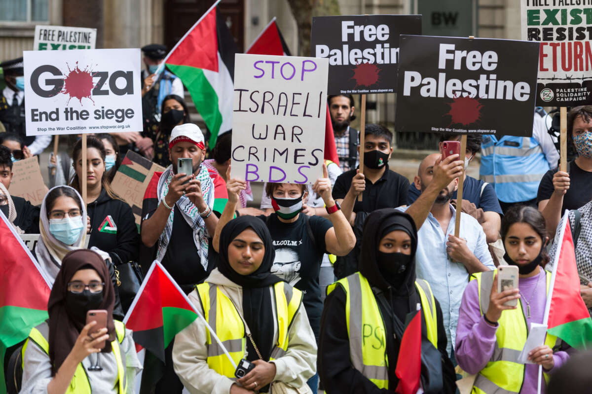 Students and pro-Palestinian supporters gather outside the Student Central building at the University of London to take part in a protest calling for U.K. universities to stop investing and cooperating with companies and institutions involved in breaches of international law carried out by the Israeli government in the Palestine, in London, United Kingdom, on July 9, 2021.