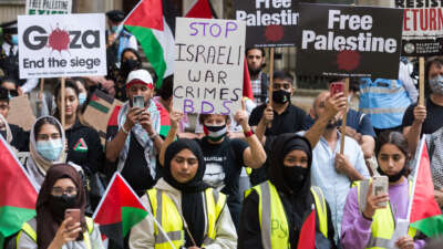 Students and pro-Palestinian supporters gather outside the Student Central building at the University of London to take part in a protest calling for U.K. universities to stop investing and cooperating with companies and institutions involved in breaches of international law carried out by the Israeli government in the Palestine, in London, United Kingdom, on July 9, 2021.