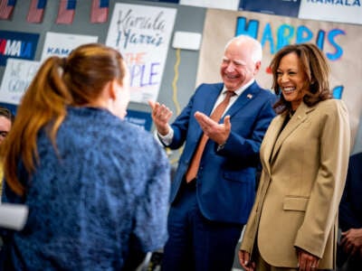 Democratic presidential candidate Vice President Kamala Harris and Democratic vice presidential candidate Minnesota Governor Tim Walz visit a campaign office on August 9, 2024, in Glendale, Arizona.