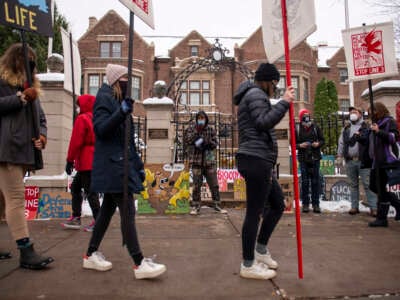 People protest against the Enbridge Energy Line 3 oil pipeline project outside the Governor's Residence, St. Paul, Minnesota, on November 14, 2020.