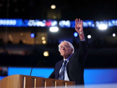 Bernie Sanders waves at the DNC crowd