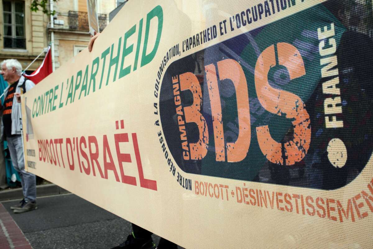 A banner reading Boycott, Disinvestment, Sanctions and Against apartheid, boycott Israel is is displayed during a protest in Toulouse, France, on May 18, 2024.